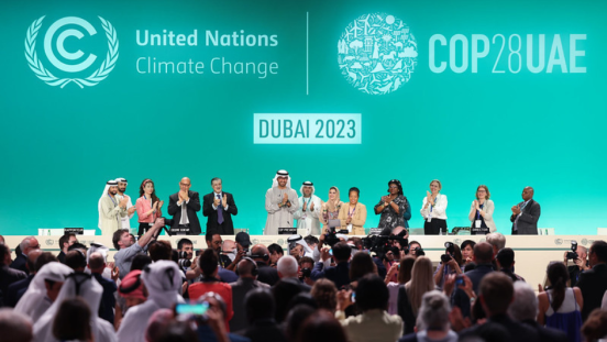 People applauding at COP28 negotiations
